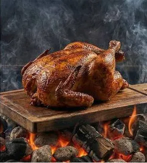 A whole smoked chicken with crisp golden skin