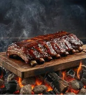 A rack of glazed smoked pork ribs on a board